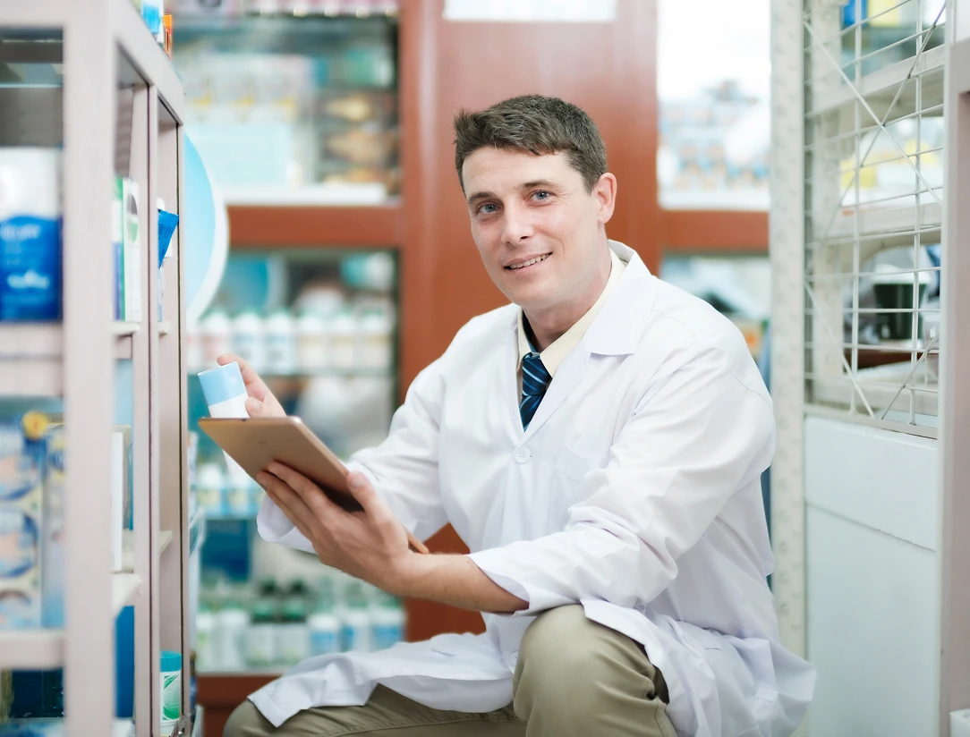 A healthcare worker holds a tablet